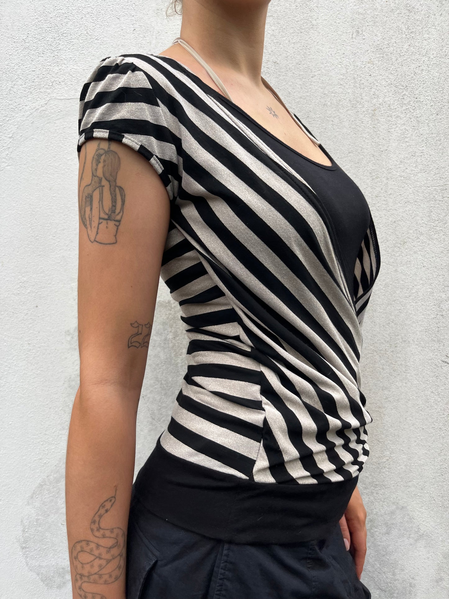 gold and black stripy top