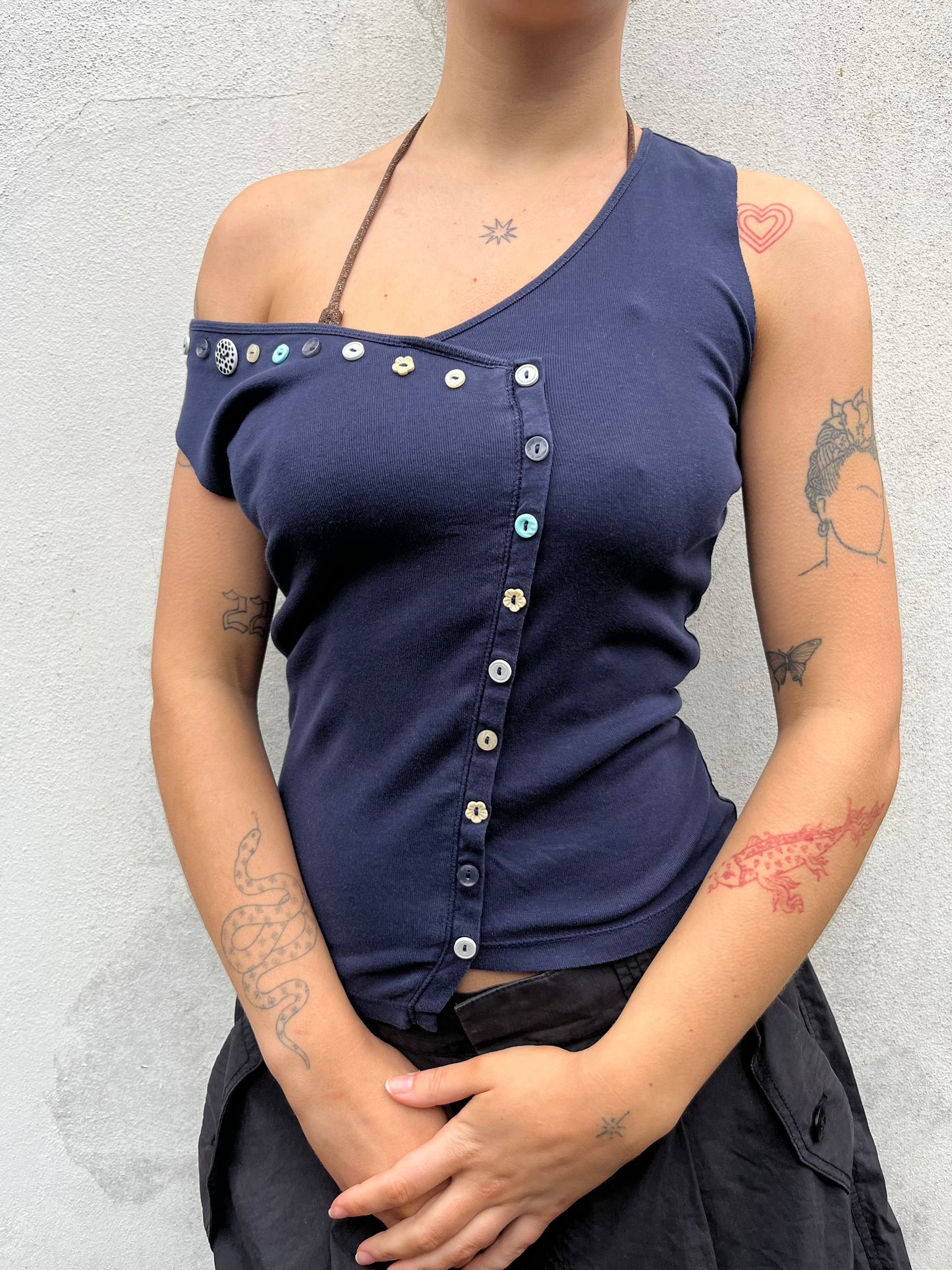 asymmetric button top