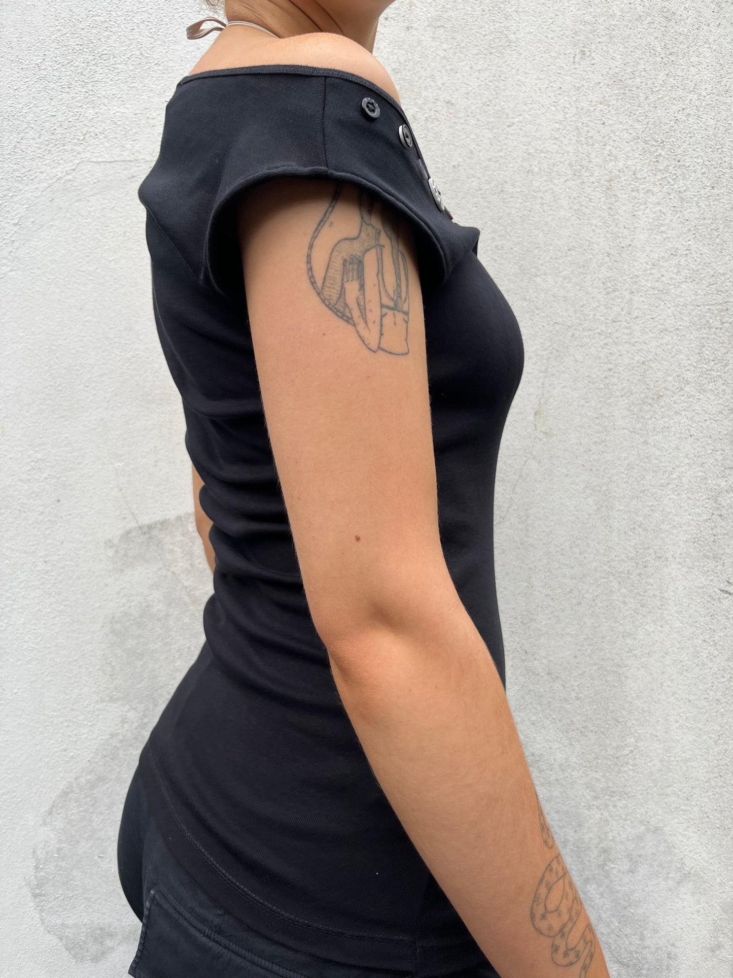 black asymmetric button top