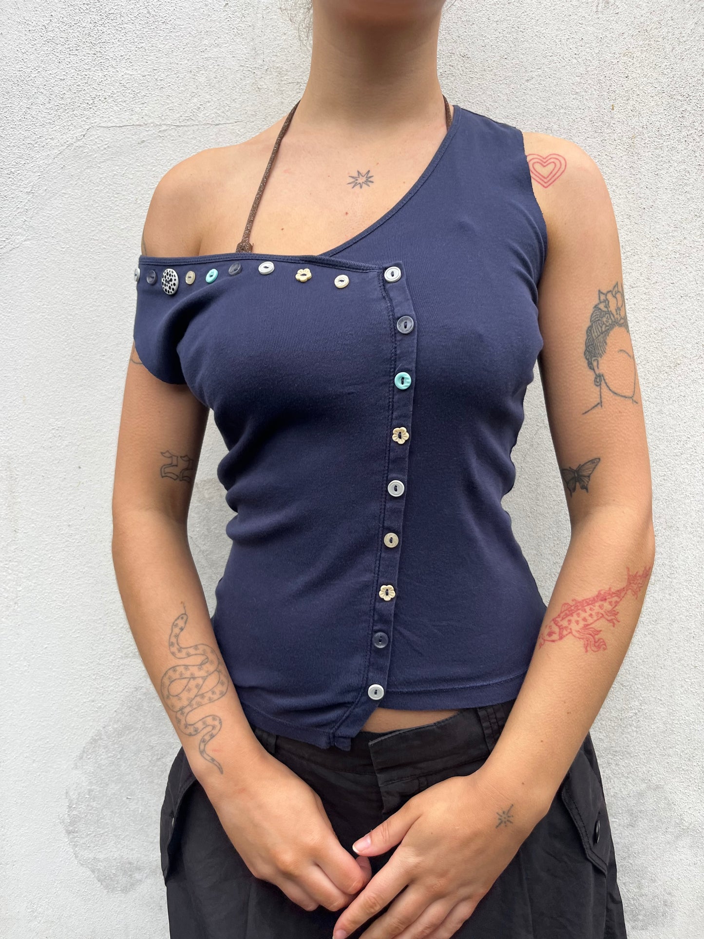 asymmetric button top