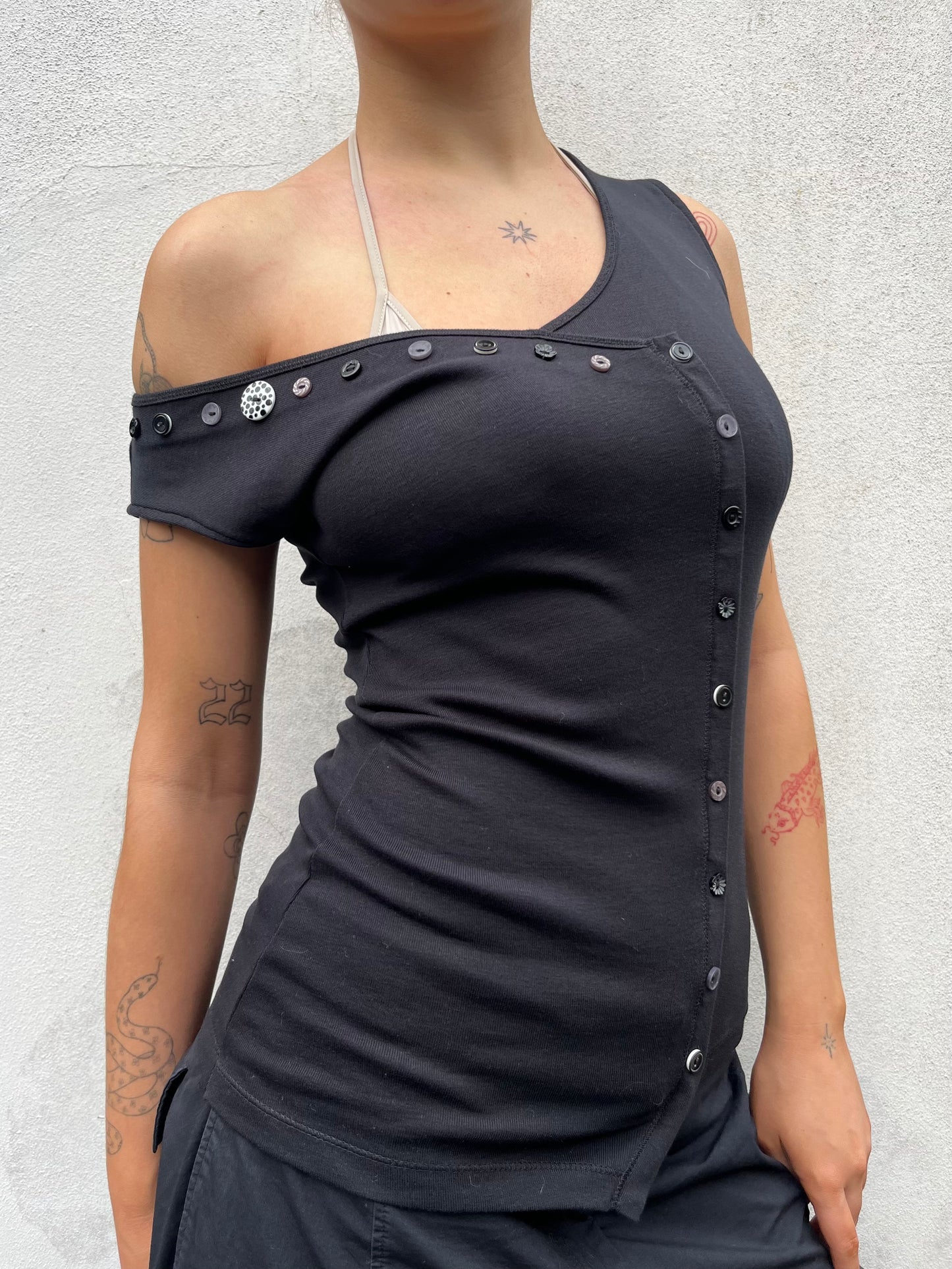 black asymmetric button top