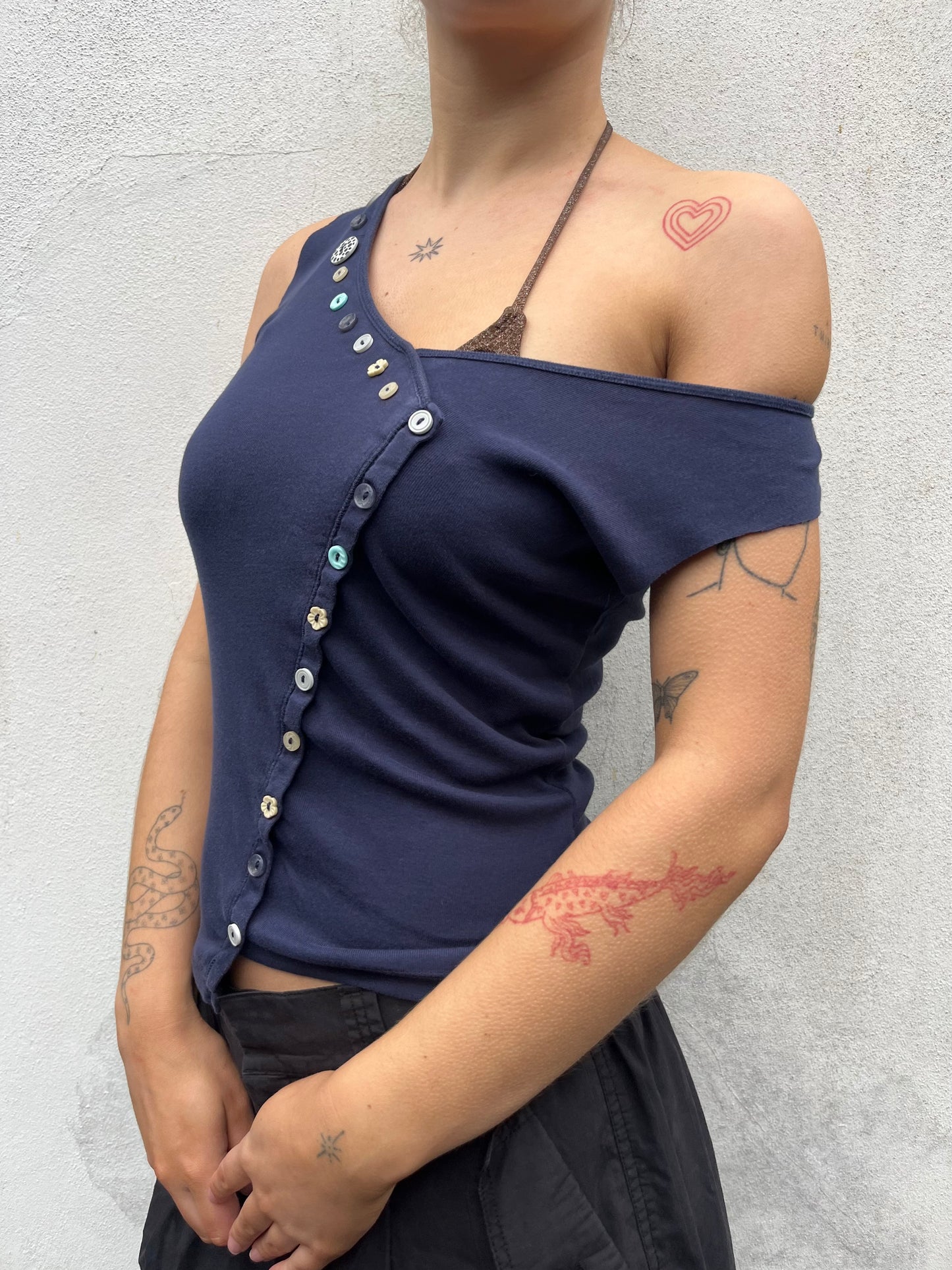 asymmetric button top