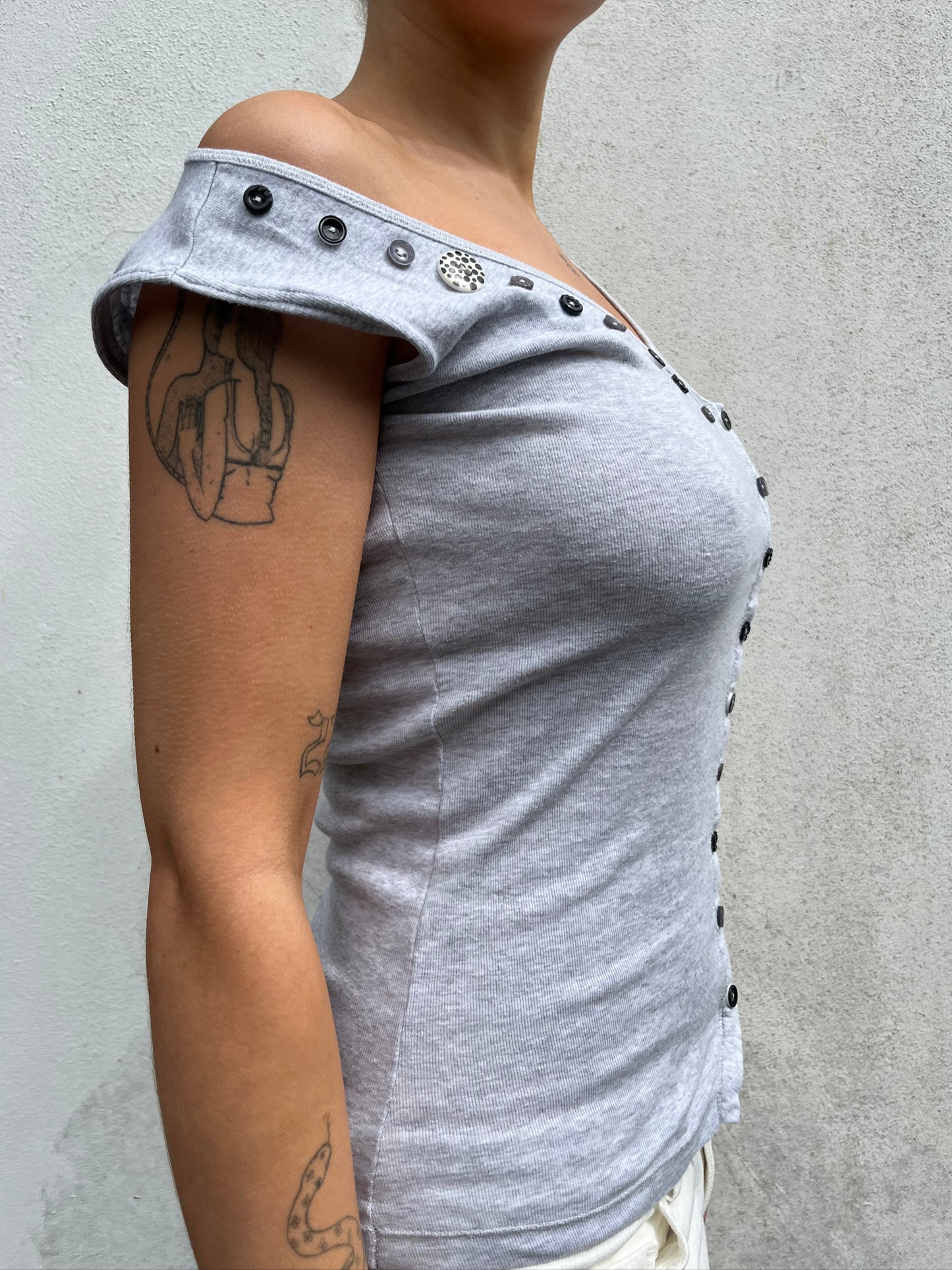 asymmetric button top