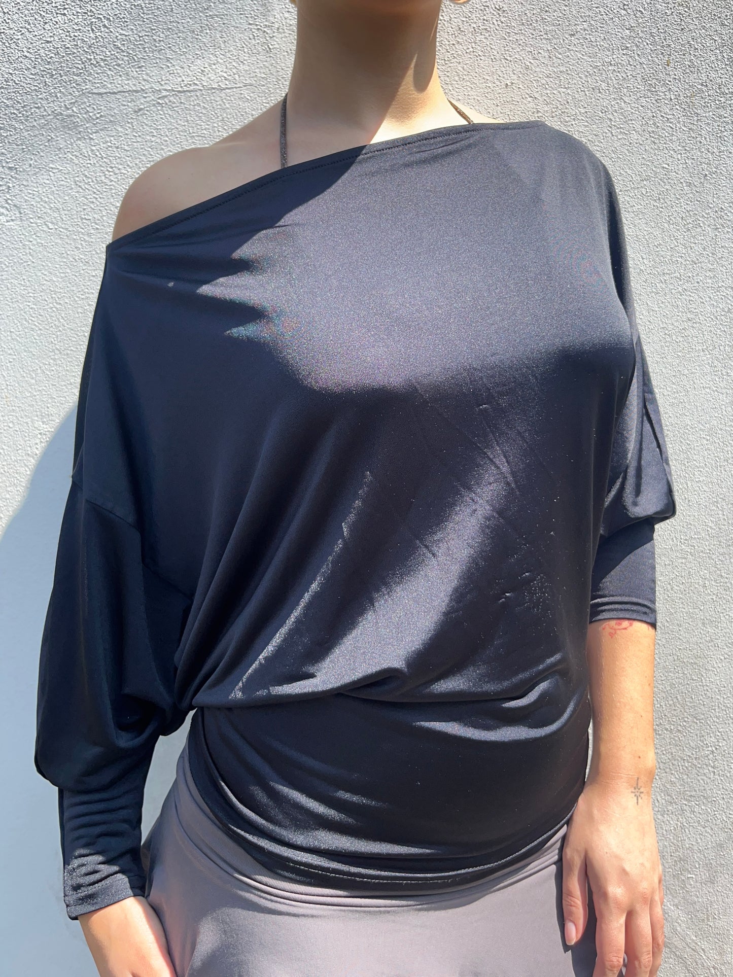 black slinky batwing top