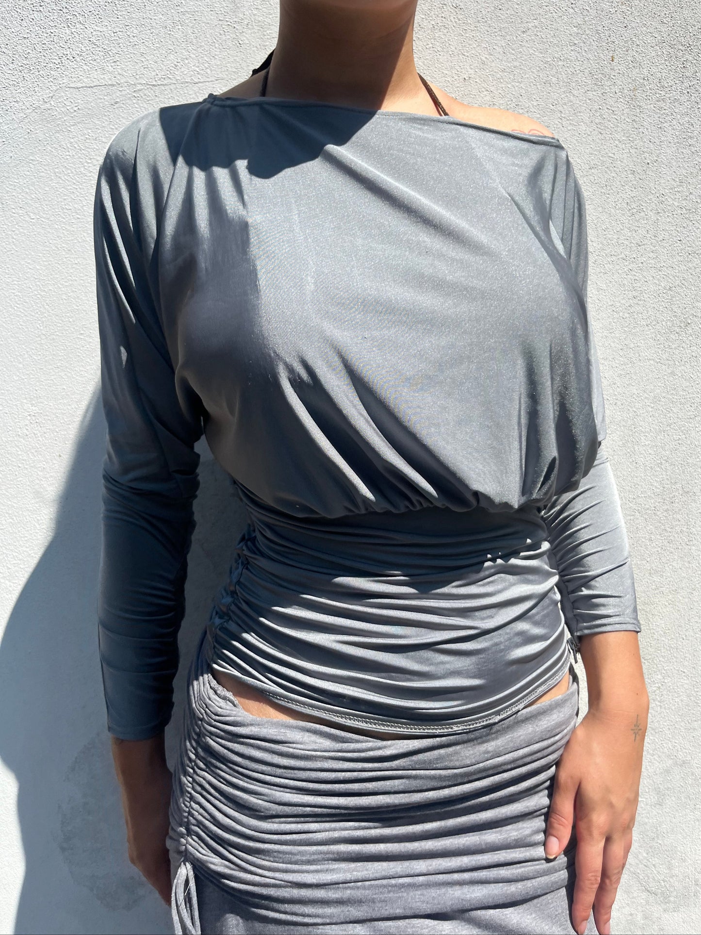 shiny batwing top