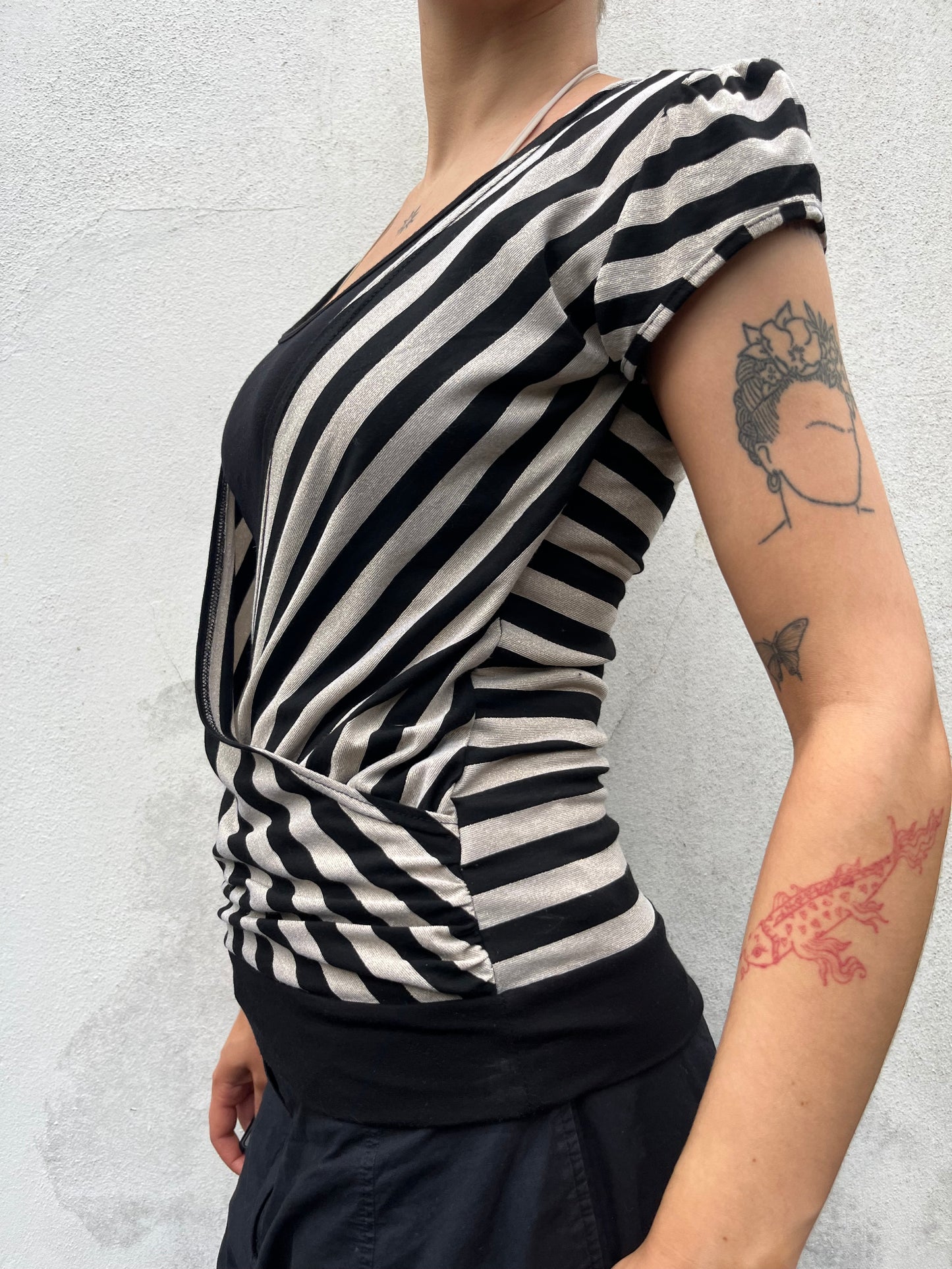 gold and black stripy top