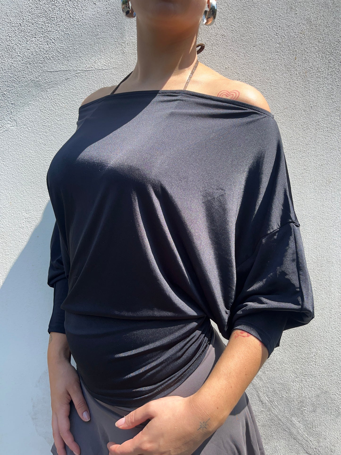 black slinky batwing top