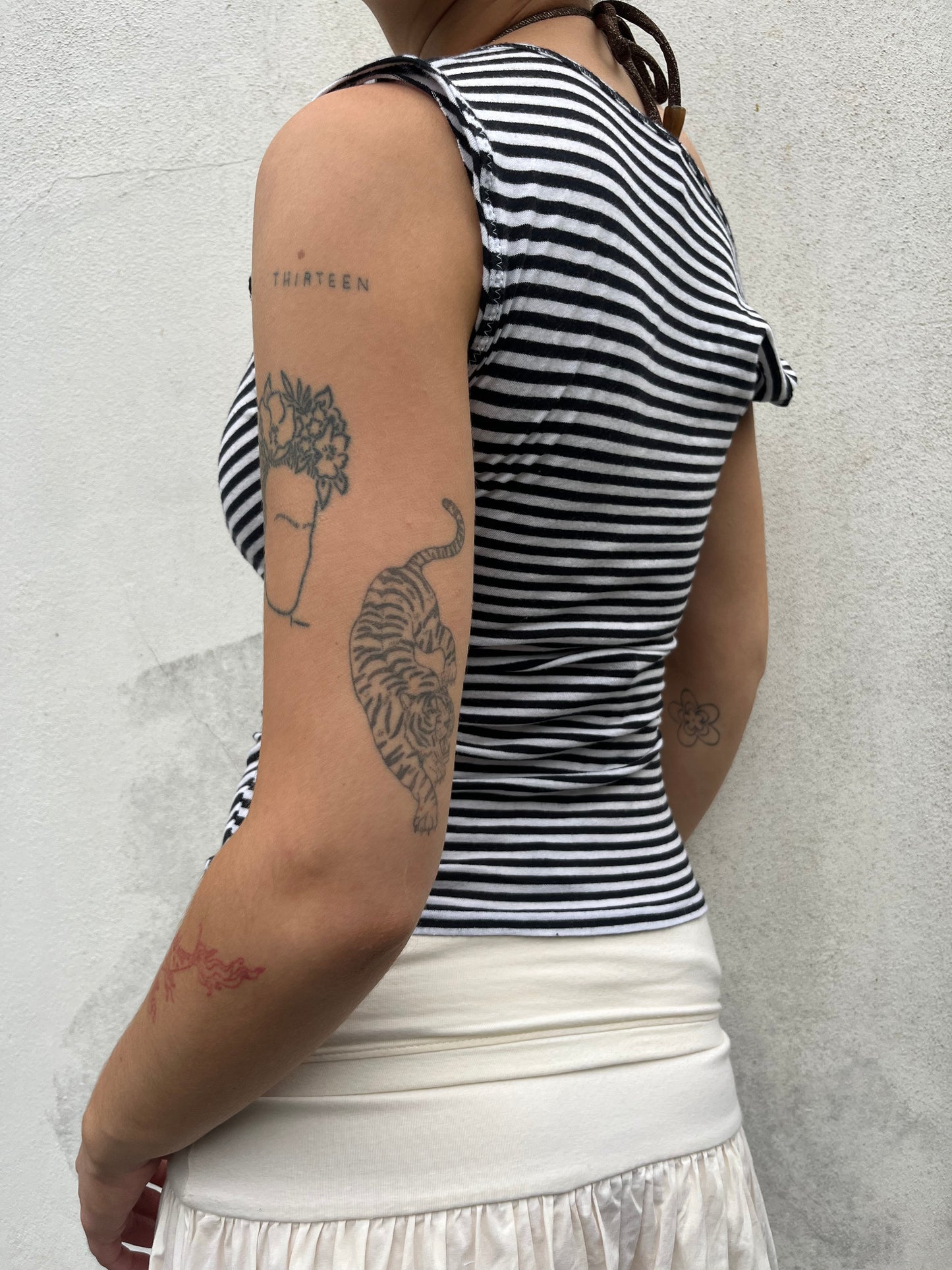 stripy asymmetric button top