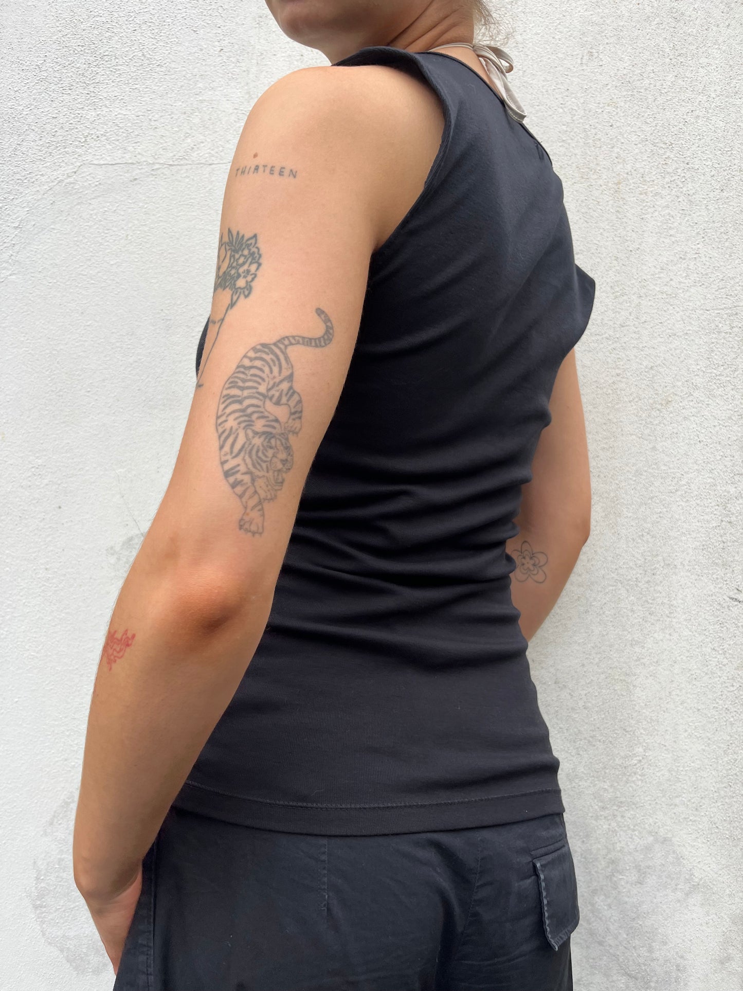 black asymmetric button top