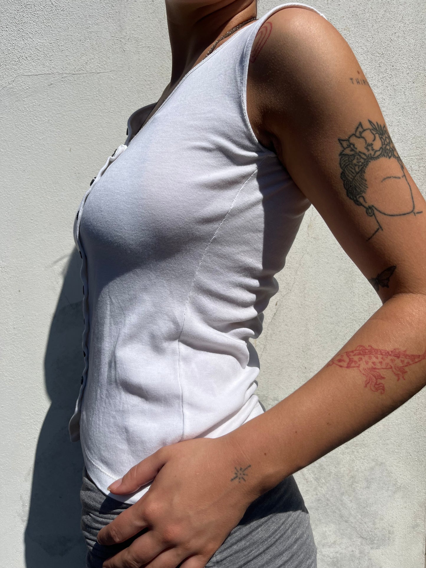 white asymmetric button top