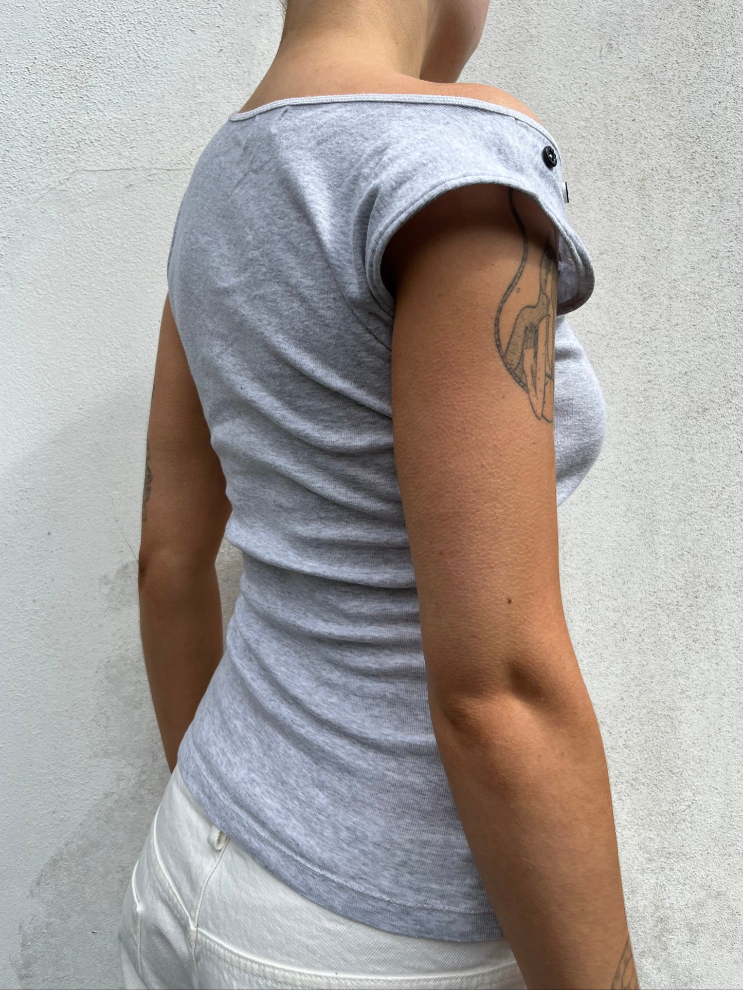 asymmetric button top