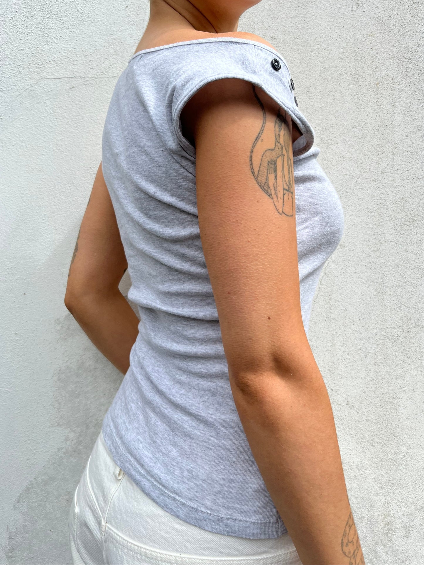 asymmetric button top