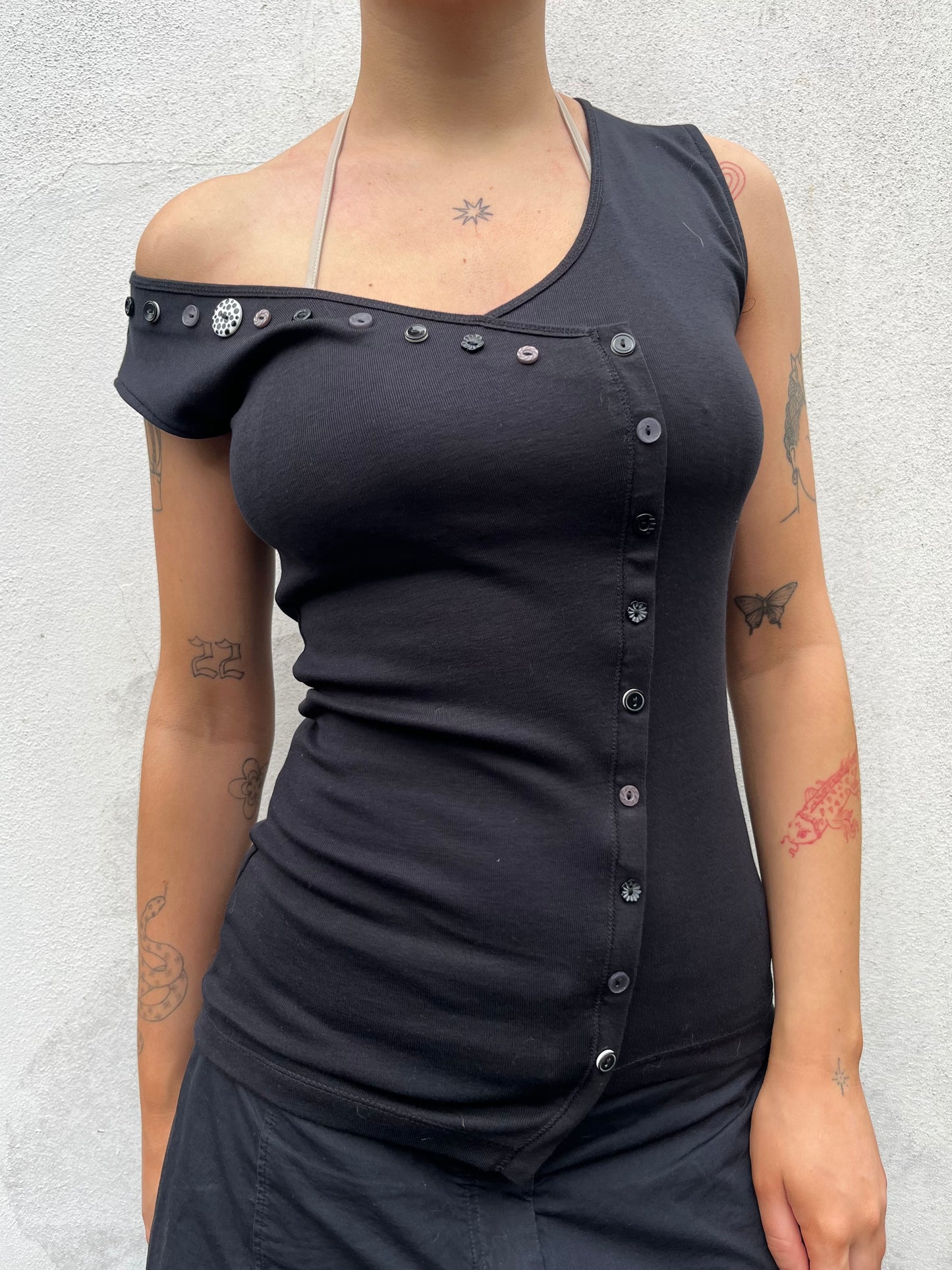 black asymmetric button top