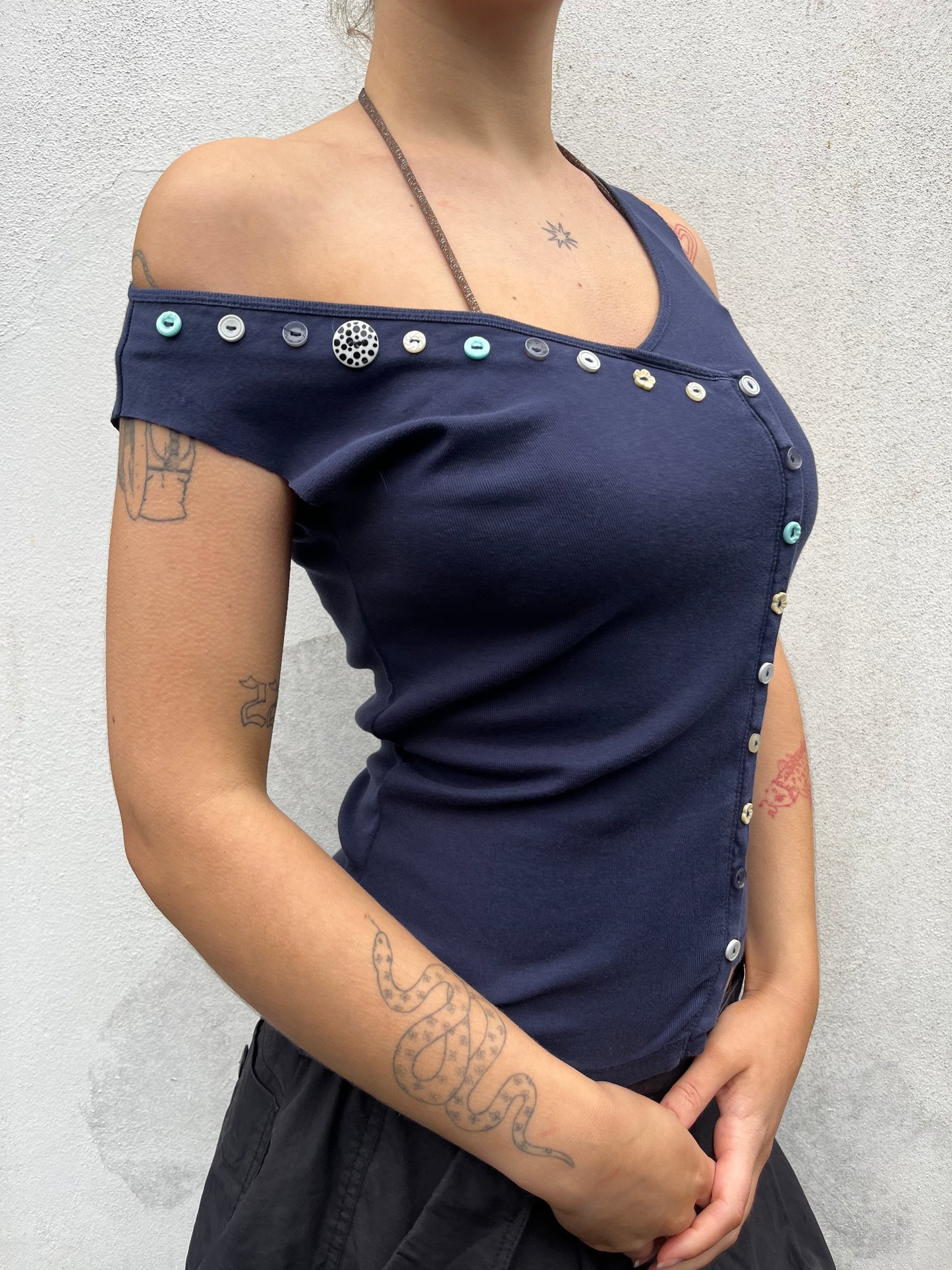 asymmetric button top