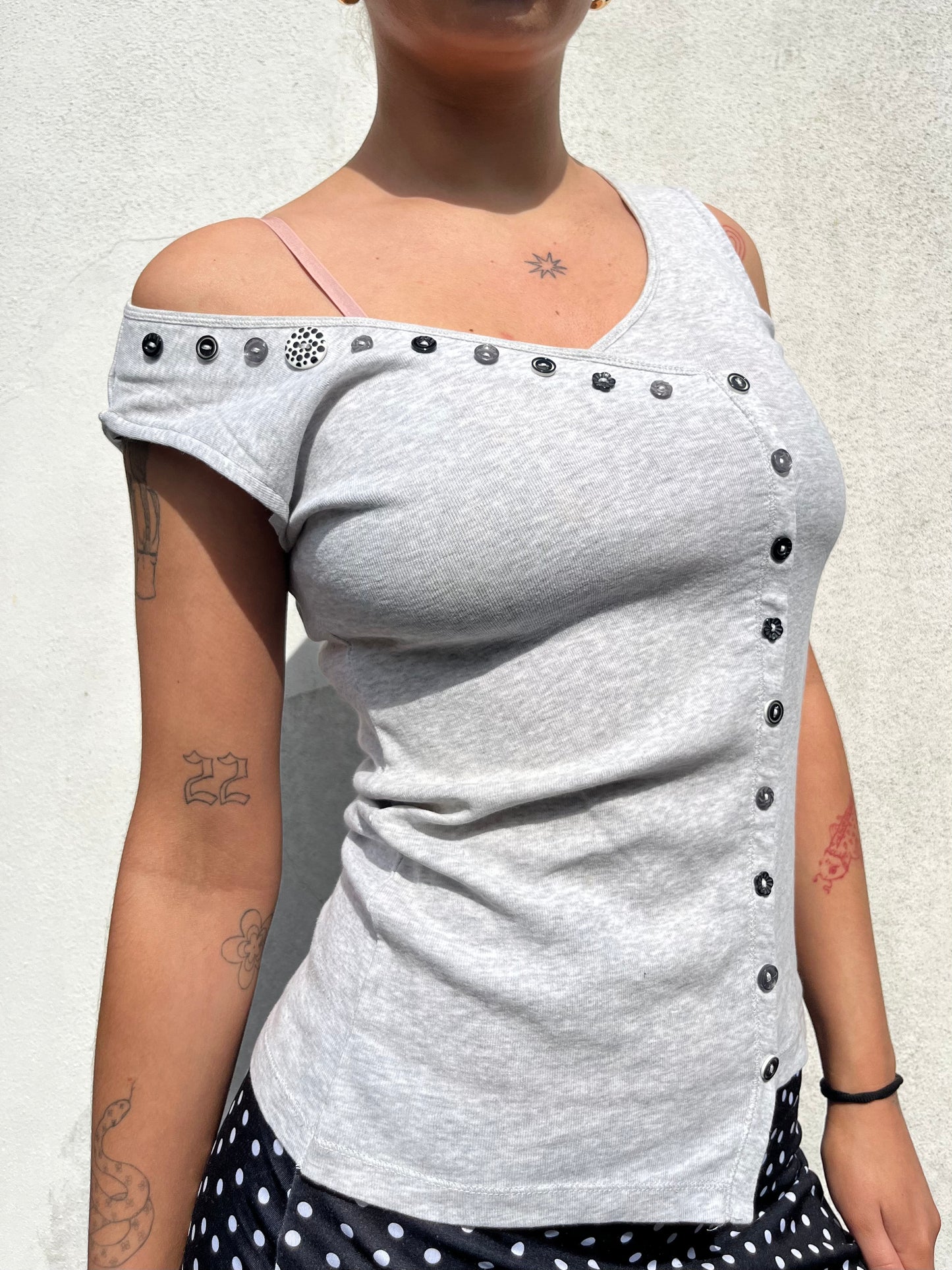 asymmetric button top