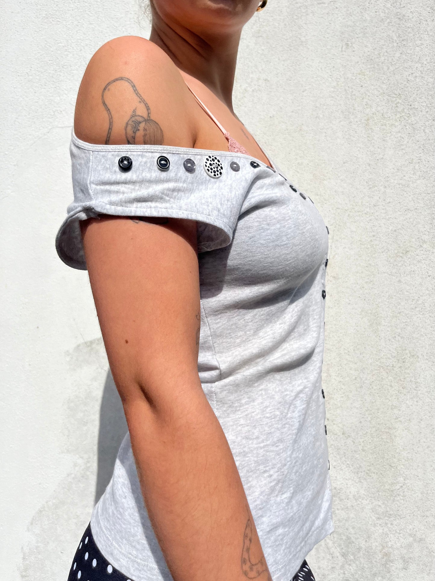 asymmetric button top