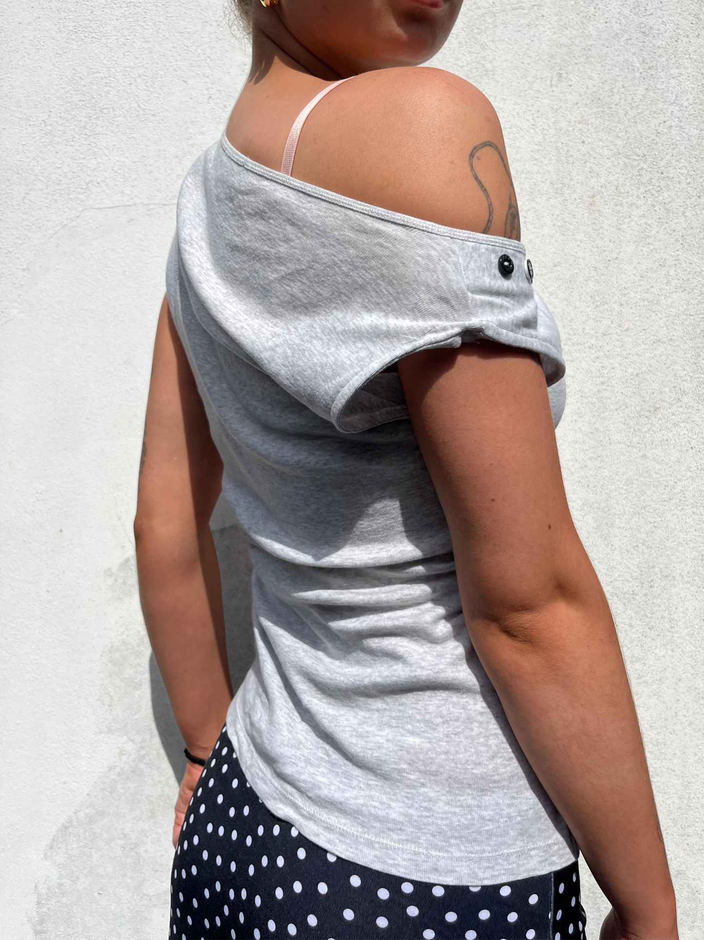 asymmetric button top