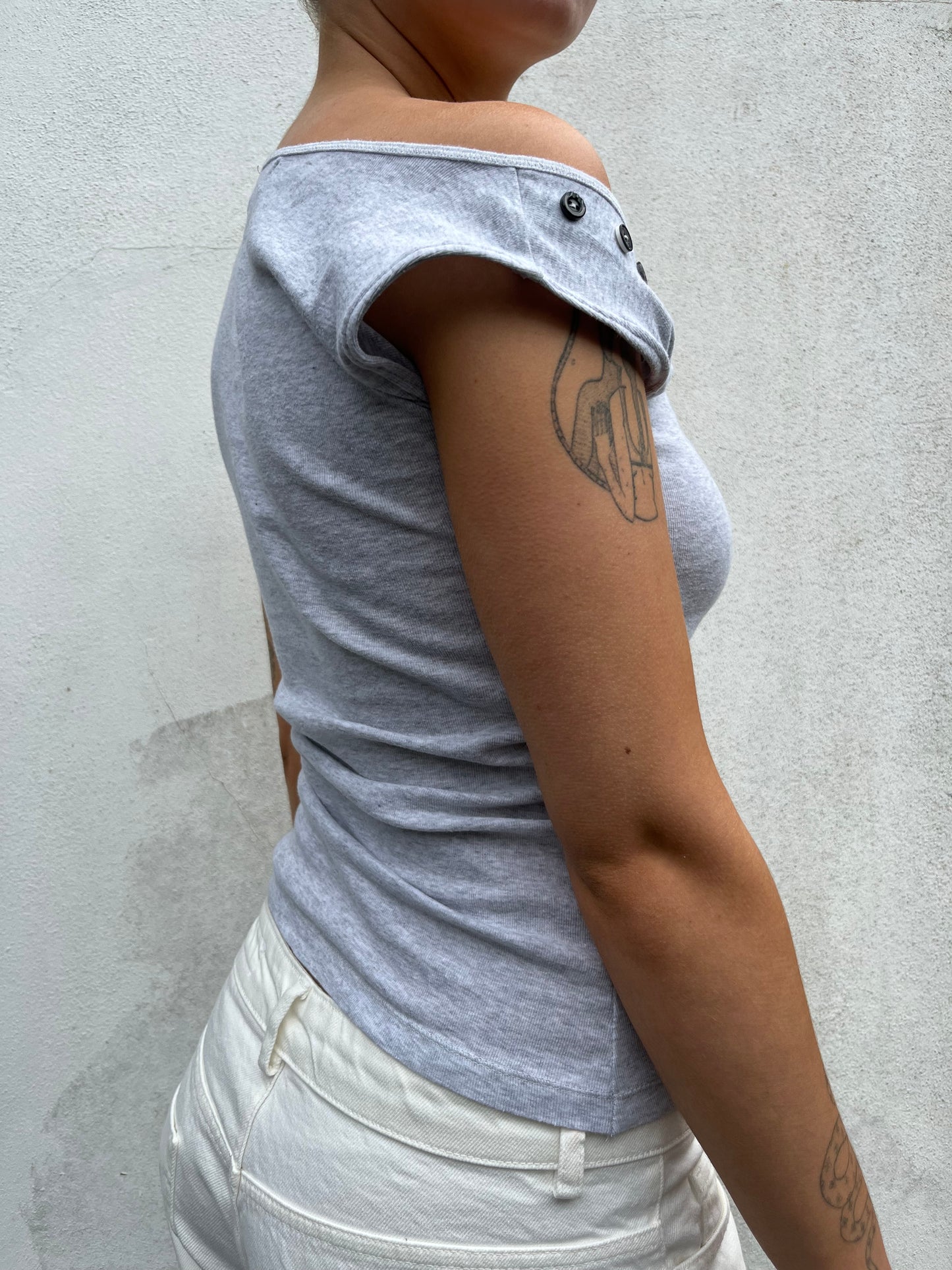 asymmetric button top