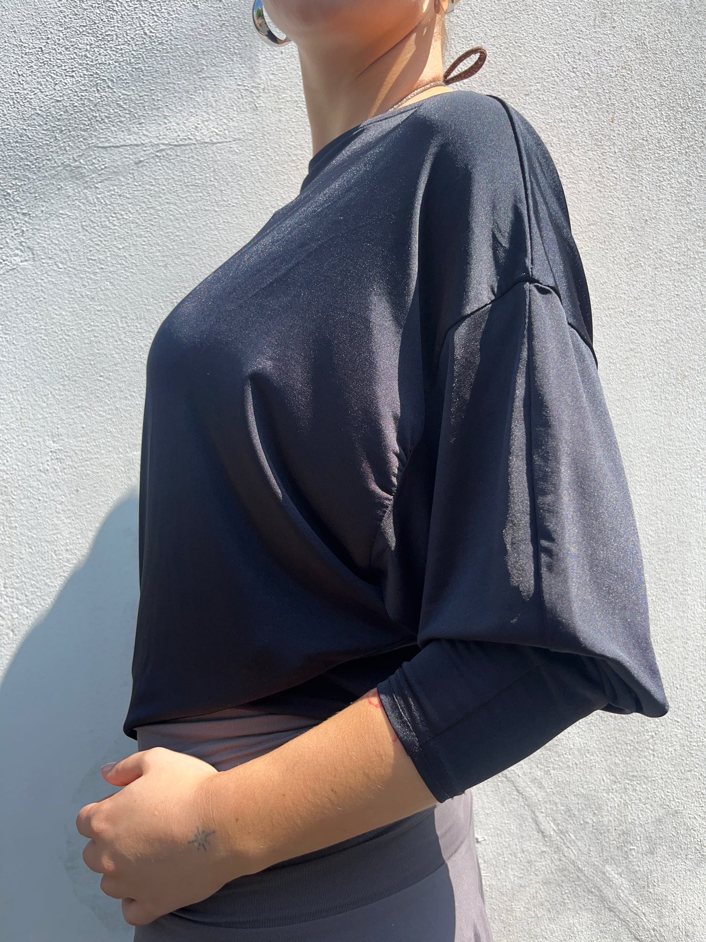 black slinky batwing top
