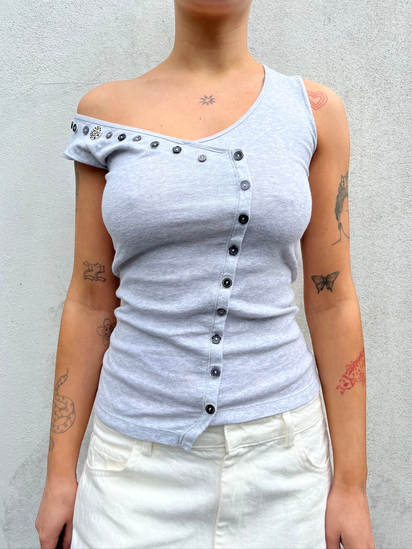 asymmetric button top